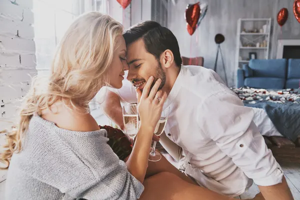 A couple sharing an affectionate moment at home